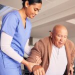 A professional caregiver assisting an elderly client, demonstrating high standards of home care compliance in PA.