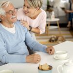 An adult daughter having a warm conversation with her aging parent about accepting help at home in Pennsylvania.